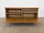 This oak low sideboard/cabinet is designed by Henning Kjærnulf and produced by EG Kvalitetsmøbler in Denmark during the...