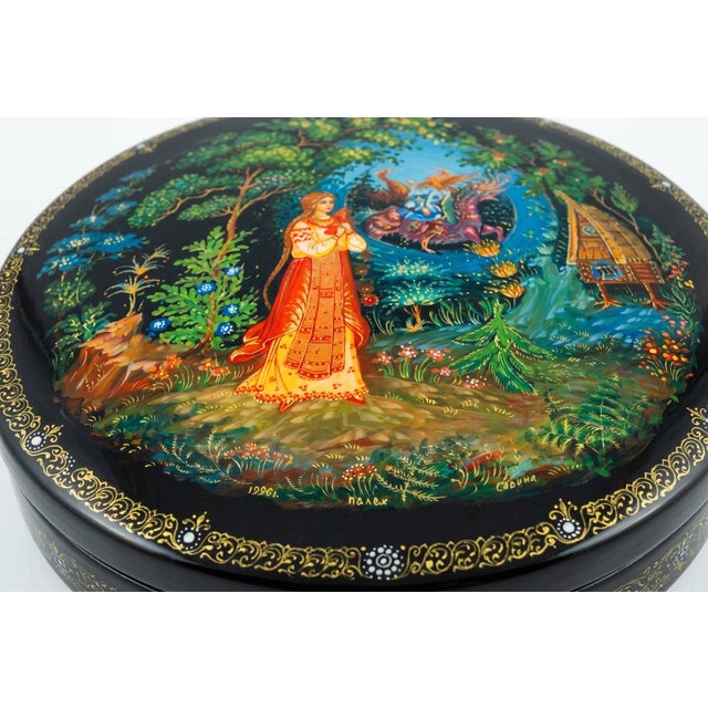 Round Russian lacquer trinket box beautifully hand painted with a scene from the fairy tale "The Princess and Seven...
