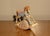 American music box depicting a rocking horse. Once wound, the music box begins to swing, simulating the swaying of...