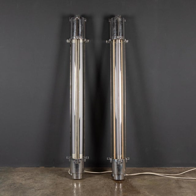 A wonderful mid-20th century polished aluminium and steel industrial lights with two led strip lights inside a sealed...