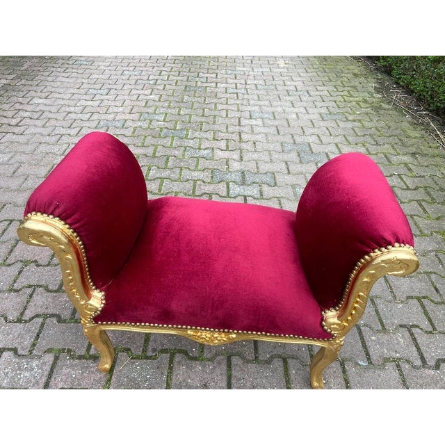 This elegant circa 1970 French Louis XVI–style bench combines refined neoclassical proportions with rich red velvet...