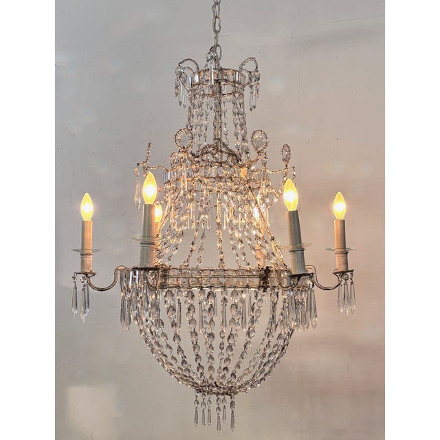 A genuine early 19th century French candle chandelier now converted to electric. Crystal and cut glass. Measurement of...