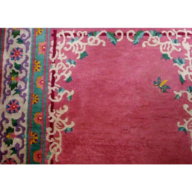 Handmade vintage ARt Deco Chinese rug in fuchsia colour and with all-over design. The rug is from 1930s, in original good...