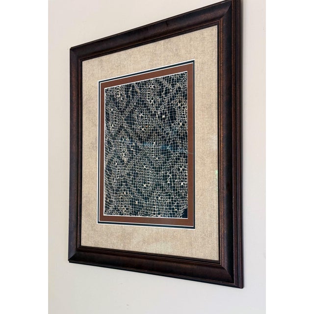 A framed Pre-Columbian hand-woven gauze panel with open lattice design from Chancay culture (10-15th century). Located in...