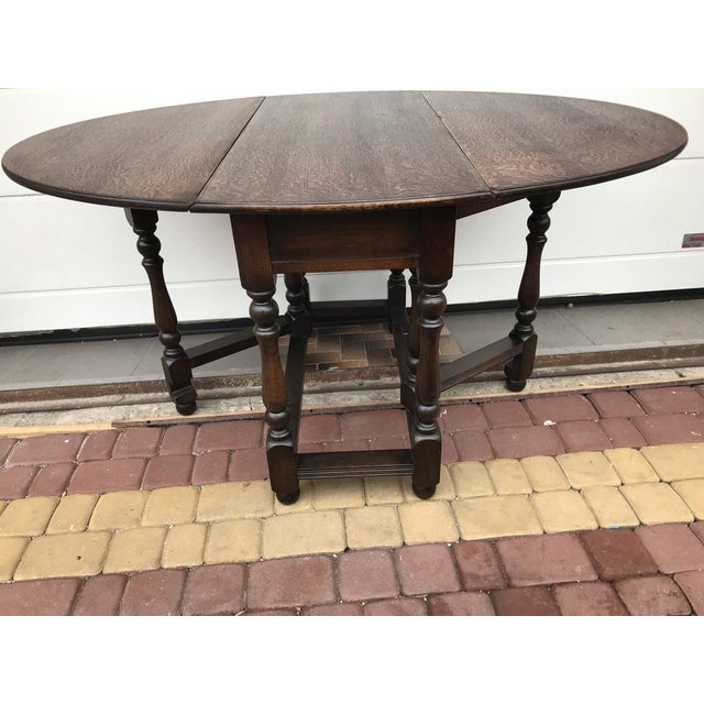 A flap table signed Old Charm with a BROS WARE wood warranty, dates back to the Tudor and Elizabethan eras - a golden age...