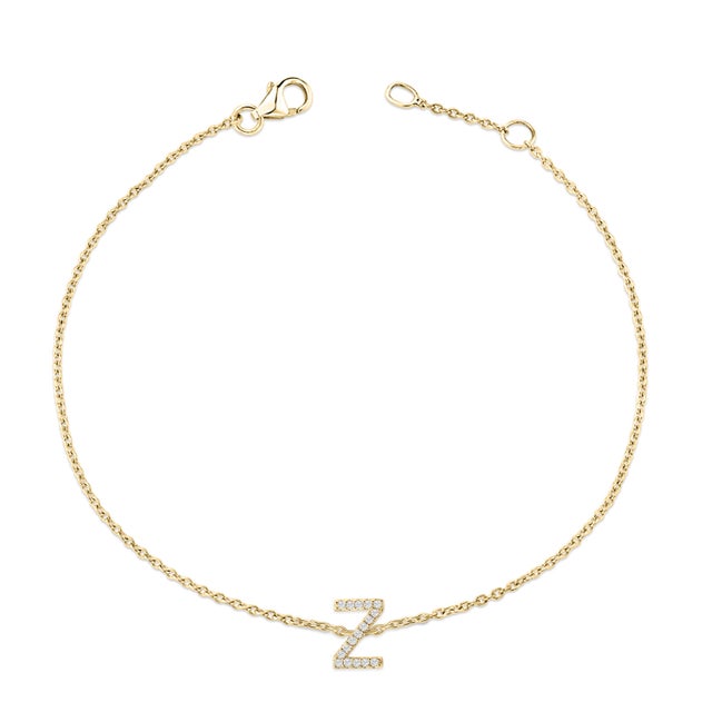 Immerse yourself in the understated elegance of this 10K yellow gold bracelet, for an enrapturing shimmer that captures...