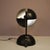 A rare “ruspa” table lamp designed by gae aulenti, manufactured by martinelli luce in italy in the 1960s. This bold lamp...