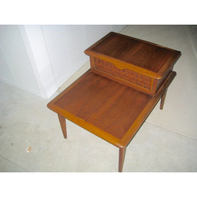 Midcentury Warren Church design two tiered side table. Made of heavy walnut and manufactured between 1960 and 1969 by the...