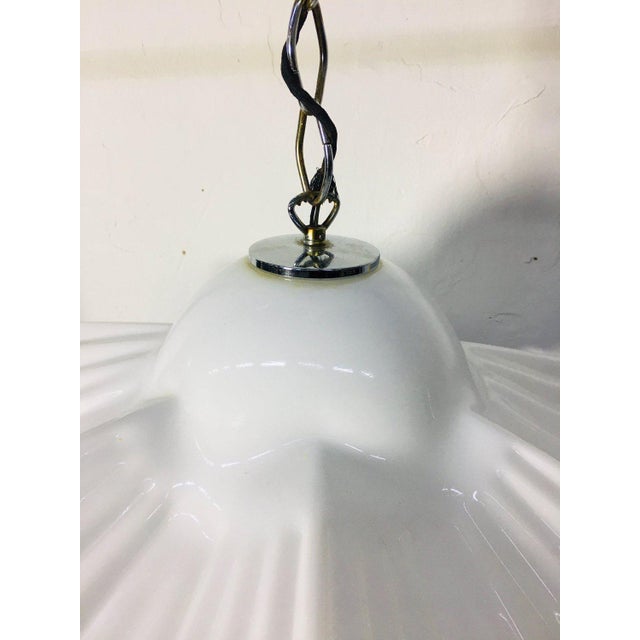 Hand blown Murano glass Italian hanging lamp with a wavy, white glass shade from the 1980s, the Vetri Venice 022 Glass...
