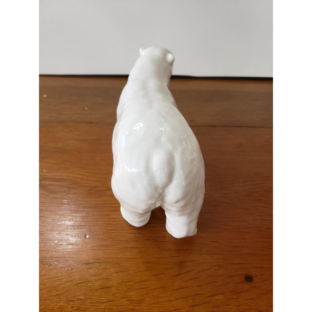 This is a Vintage 1958-1966 English Beswick Polar Bear Figurine by Arthur Gredington. It measures 4 5/8" high, 8" long and...