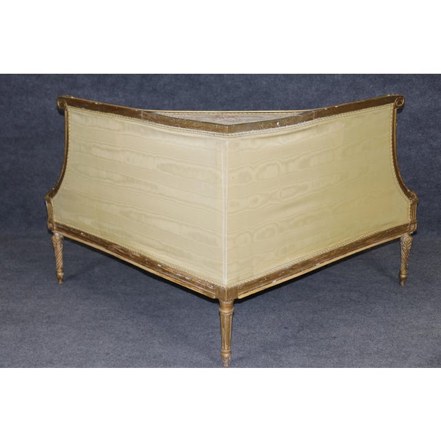 It was made for a corner — and yet it refuses to be hidden. This rare and distinctive French Louis XVI giltwood corner...