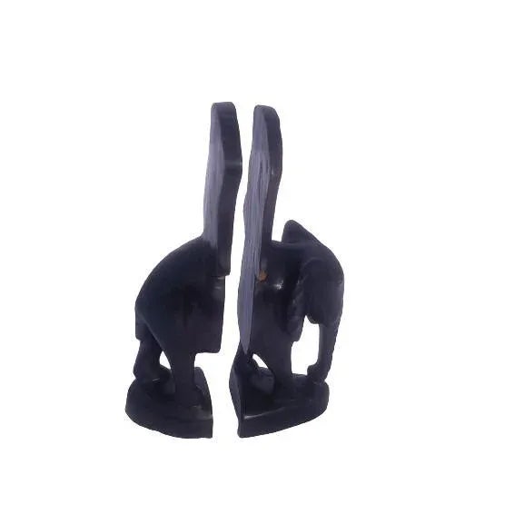 Arrange your books on a shelf or desk with this handmade African elephant bookend carved from wood Made in Ghana