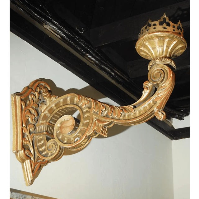 Pair of massive hand-carved gilt wood sconces. Made in the 1950s.