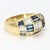 This 18k yellow gold ring has a checkerboard pattern made up of alternating diamond & blue sapphire baguettes. - Stone...