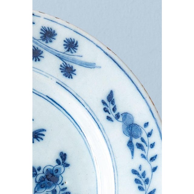 18th Century Dutch Delft Blue and White Chinoiserie Plate with Flowers For Sale - Image 3 of 7