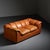 Cocker sofa designed by Franco Bresciani for Poltrona Frau in Italy in the late 1970s. Upholstered entirely in cognac-...