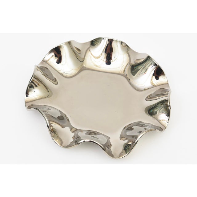 This lovely and chic vintage bowl is silver mirrored glass and has ruffled form or scalloped form top.It is a great...