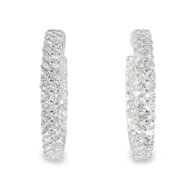 14K White Gold Diamond Inside-Outside Hoop Earrings. This stunning pair features numerous brilliant round diamonds...