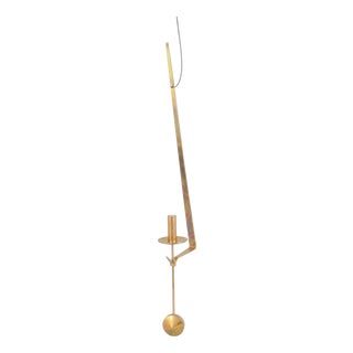Wall Candleholder in Brass with Pendulum Suspension by Pierre Forsell for Skultuna, 1960s For Sale