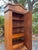 An exceptional antique armoire showcasing beautiful tramp art style carvings and timeless craftsmanship. Rich in character...