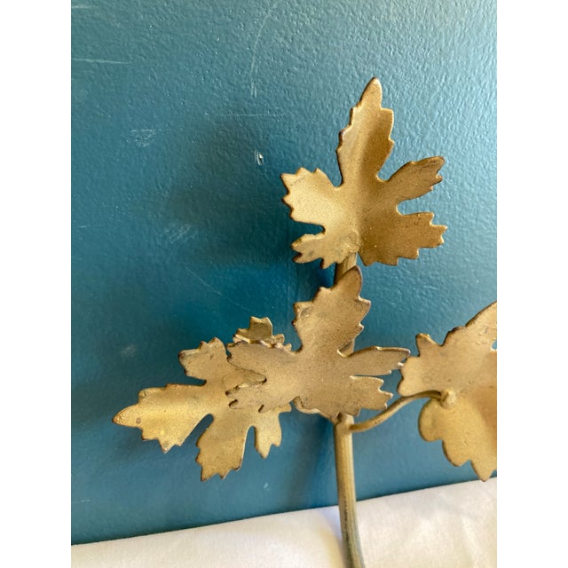 Made in Italy, this vintage wall hook features a beautiful gold painted finish and a graceful design with four detailed...