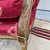 A Vintage Red Upholstered Painted Decorated and Carved French Bergere Arm Chair For Sale - Image 4 of 12