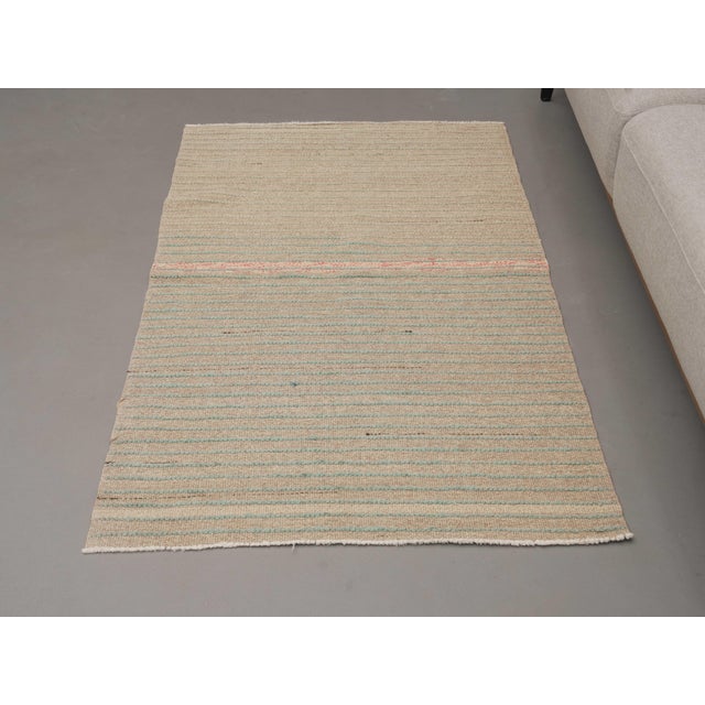Vintage Hand-Knotted runner rug is a semi-antique vintage area rug. The '70s Eastern region of Anatolia's unique rug is...