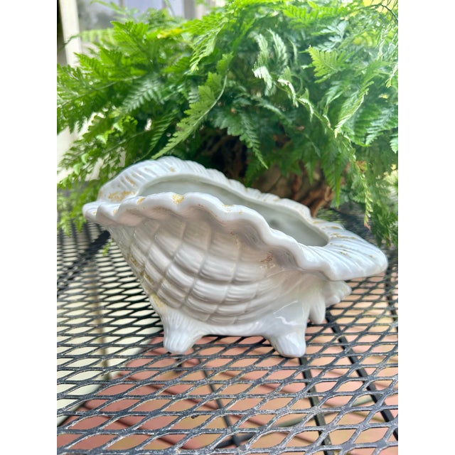 If your home is coastal, nautical, Palm Beach or you just love shells, this vintage ceramic conch shell planter is for...
