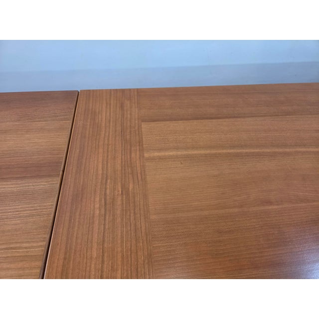 A 36 inch square draw leaf table made in Denmark. Opens too 65inches.