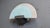 Glass wall sconce by Arteluce. The italian design wall lamp has a matte glass blue and white lamp shade and emit a soft...