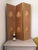 A wonderfully decorative three-panel folding screen with two distinct upholstered faces. One side features repeated...