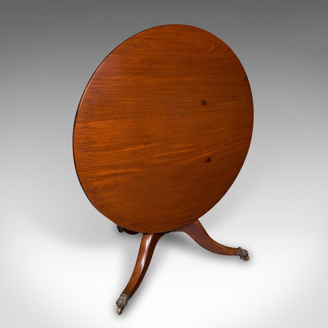 This is an antique supper table. An English, mahogany tilt-top circular table, dating to the Regency period, circa 1820....
