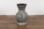 An artisan Prem Collection ceramic vase with nice rounded shape, black ground, white dripping décor and black glazed...