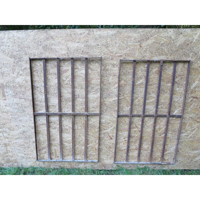 Two pieces of architectural salvage from an iron gate. Heavy and sturdy. Piece does show signs of age related wear...