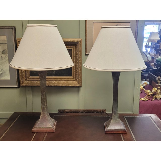 A pair of bronze modern table lamps after the original design by Stewart Ross James for Hansen Lighting. Dating to the...
