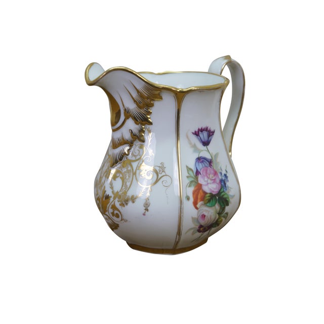 Antique 19th century porcelain pitcher / jug featuring a floral motif with hand painted bouquet of flowers, gold gilt...