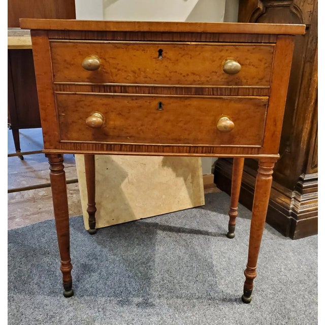 Add warmth and historic character to your abode with this charming antique side table, crafted in New England around 1840....