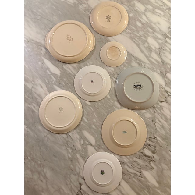 Elevate your walls with this expertly curated, 8-piece eclectic floral gallery plate collection. Each floral motif has a...