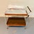 A fabulous vintage Salton Hotray rolling serving/bar cart featuring warm wood shelving, a slender metal frame, wood-...