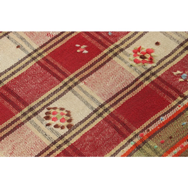 This vintage 5x8 Persian kilim is a mid-century Qashqai tribal rug, handwoven in wool circa 1950-1960. On the Design: The...