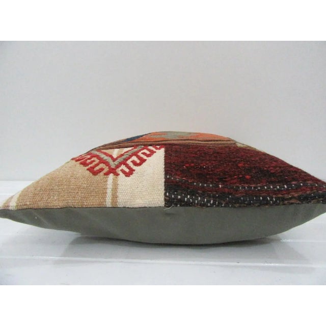 This is a pillow cover made from a vintage kilim rug. The piece was properly washed and ready to use. Pillow inserts not...