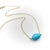This vintage Me & Ro necklace features a large turquoise bead as its focal point, held on an 18k gold chain. The turquoise...