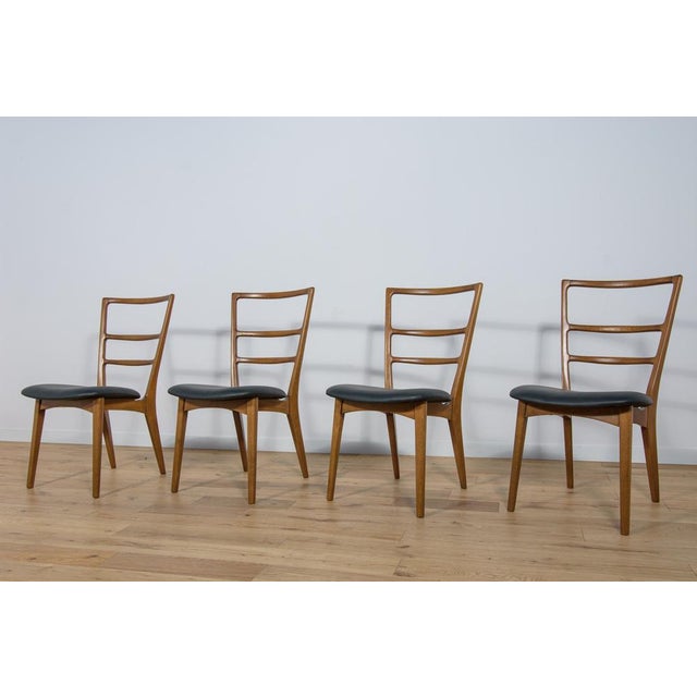 Set 4 Dining chairs designed by Marian Grabiński . Produced by Swarzędzka Furniture Factory in Poland. Completely...
