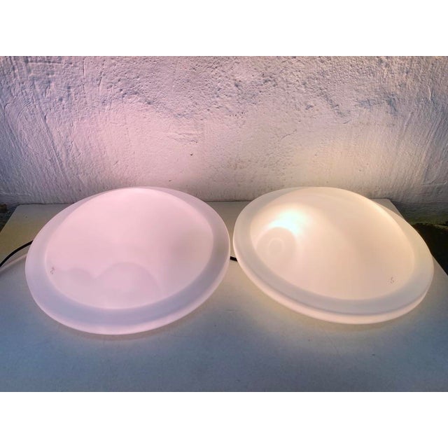 Two wall lamps from the 1970s/80s by Peill & Putzler, each with two bulbs and E27 sockets. Glass, white lacquered metal....