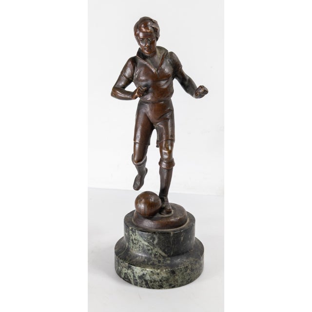 We are selling this cool early 20th century Bronze of a Footballer, or soccer player. The standing figure is posed with...