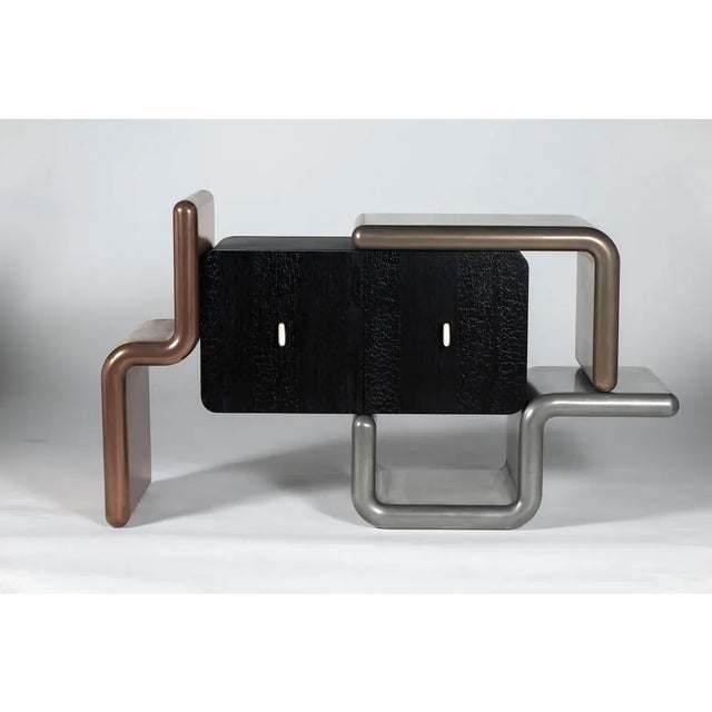 Rebound cabinet by roberto giacomucci limited edition of 3 materials: wood and liquid metal dimensions: l 140 x p 445 x h...