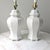 A pair of matched vintage Hollywood Regency style ginger jar lamps in original condition.