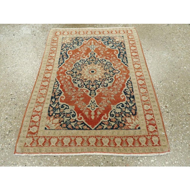 This early 20th-century Persian Tabriz Haji Jalili rug, measuring 1' 11" × 2' 7", reveals the refined artistry and...