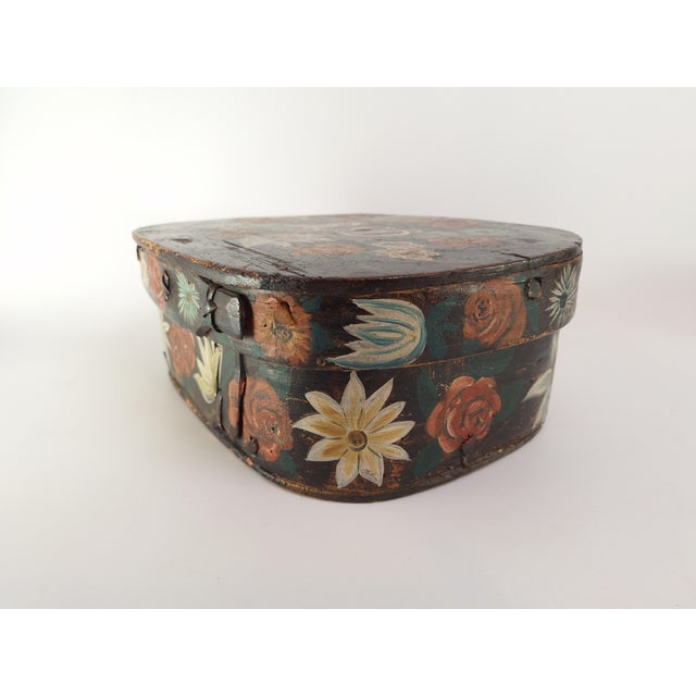 Beautiful Swedish svepask dated 1747, crafted in bentwood and richly decorated with hand-painted floral motifs and...