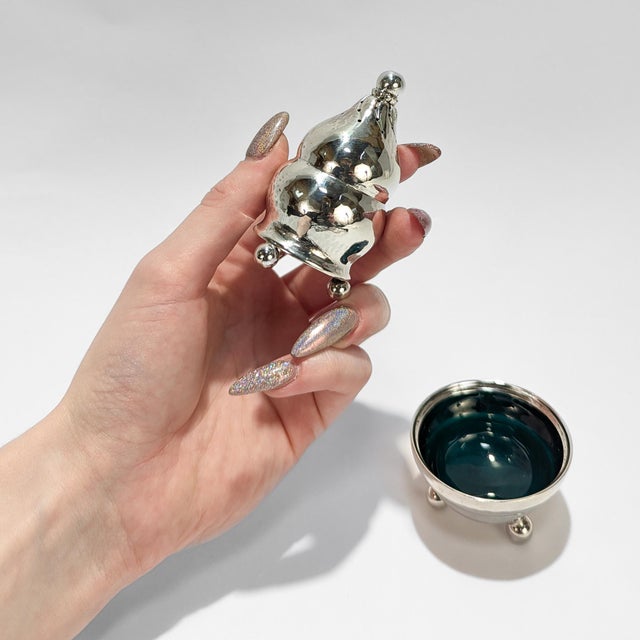 A fine antique Danish Modern silver salt and pepper set. By Georg Jensen. In sterling silver. Pattern no. 410. Comprising...